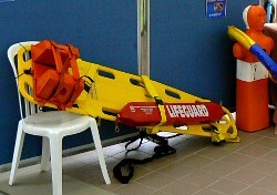 lifesaving class pool practice spinalboard